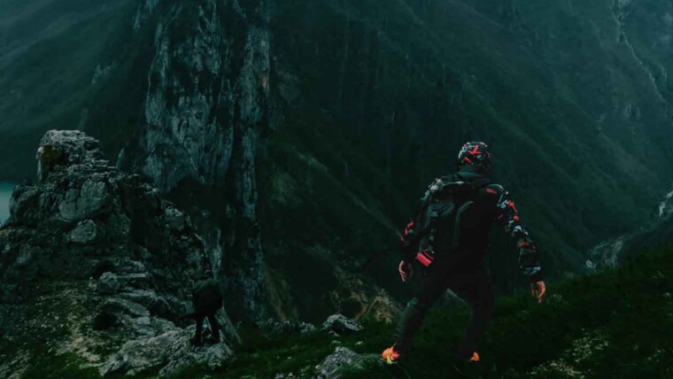 An adventurer skydiving over a stunning landscape, embodying the thrill of extreme sports.